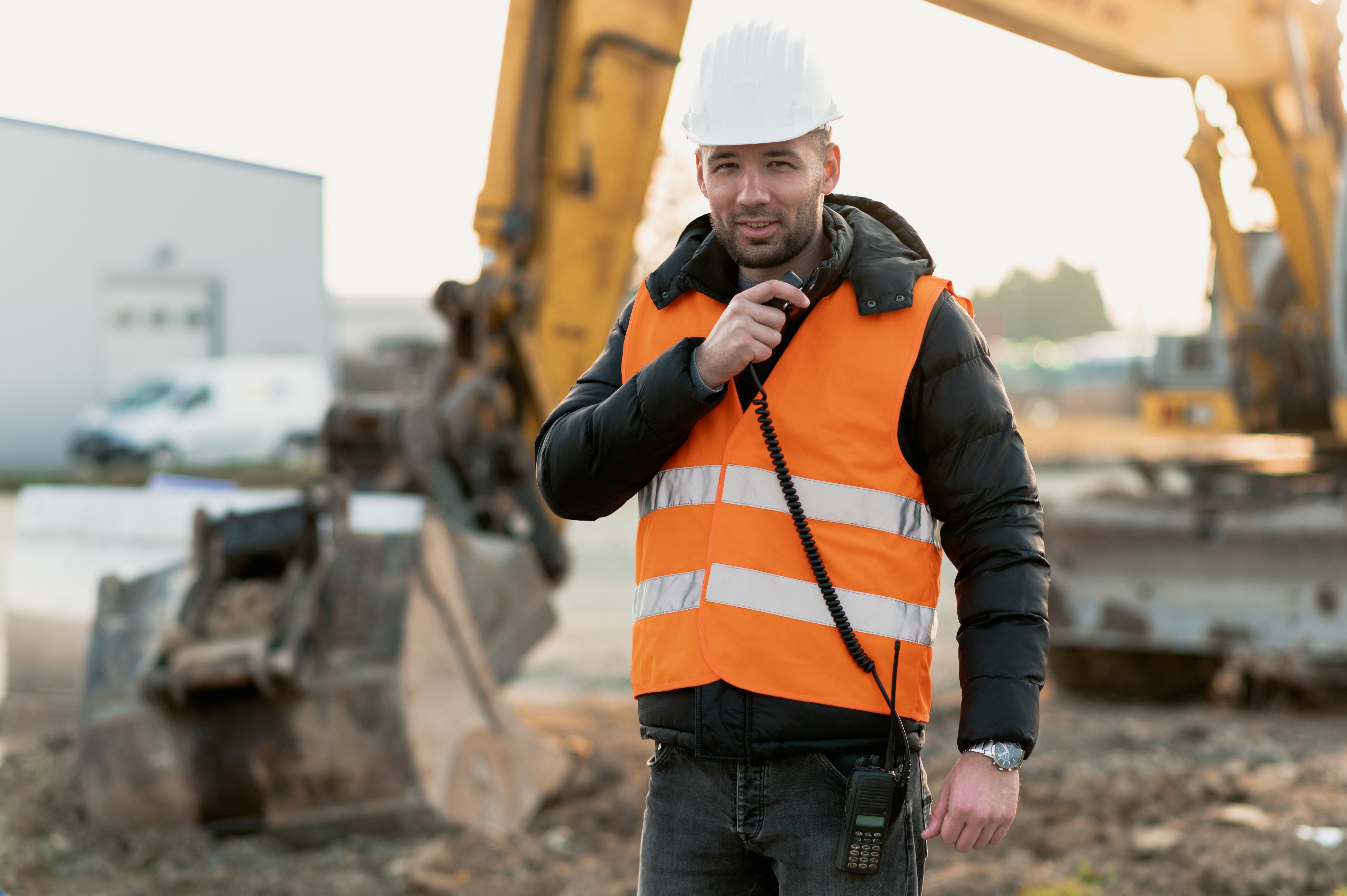 Workman with radio Watts Communications Workman with radio Watts Communications